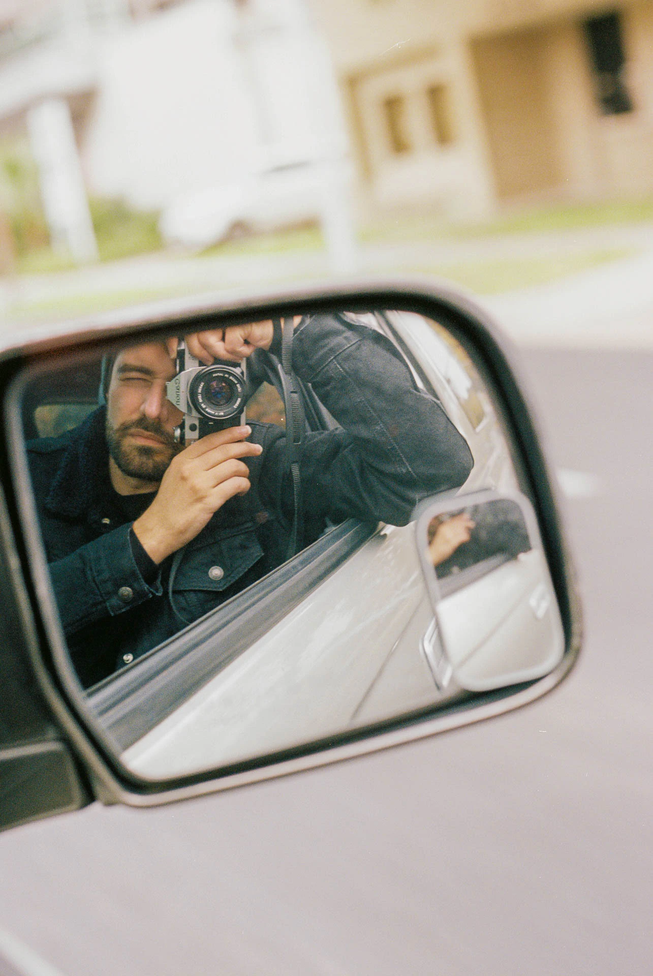 selfie of Jonathan Grado in a car oin Austin on film