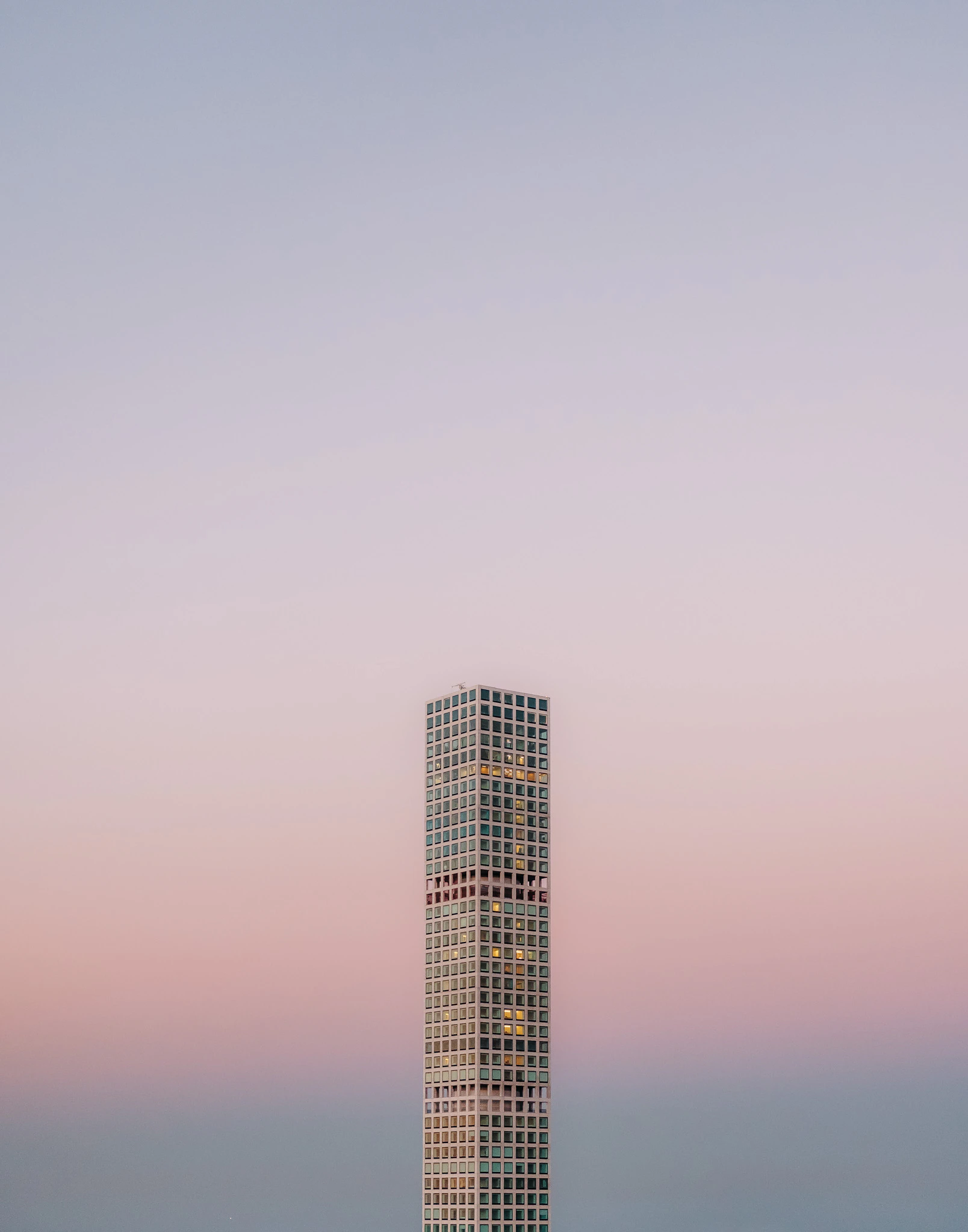 432 Park Ave skyscraper building with sunset behind it in New York City. Immediate Occupancy from Jonathan Grado's Provided You're Still Here series.