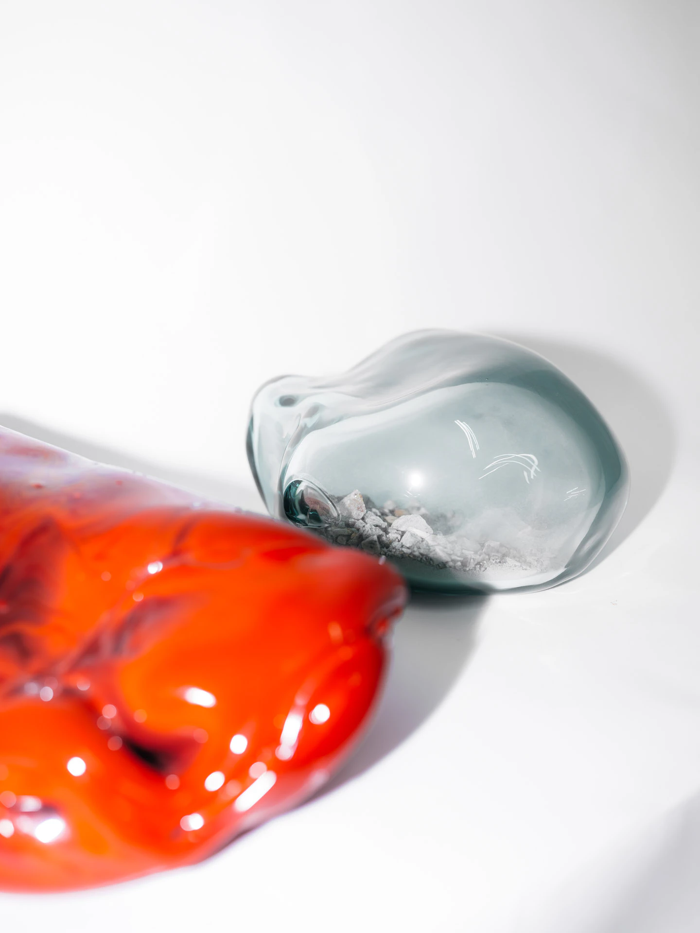 red sculpture and glass works in Lara Saget studio