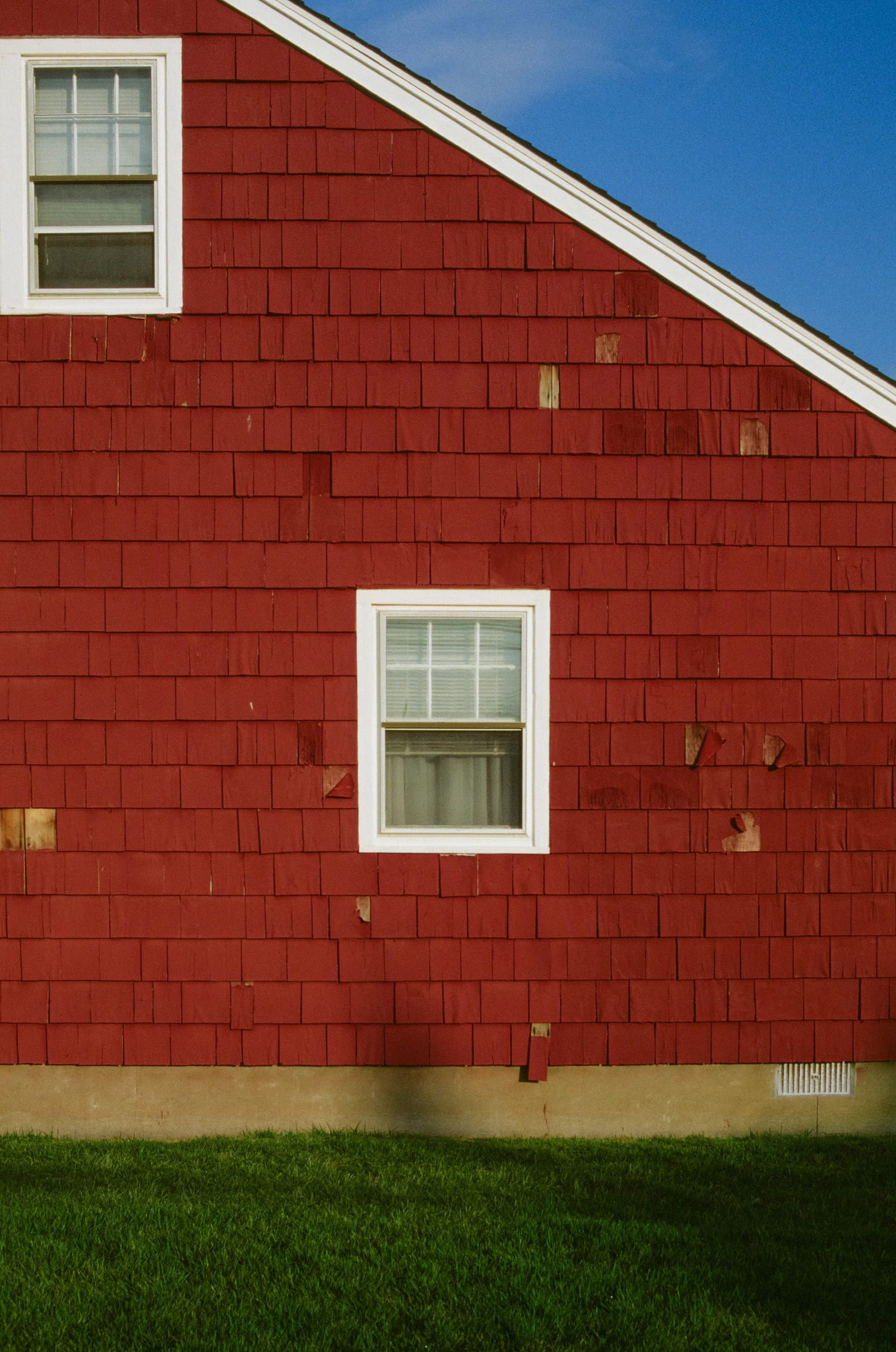 Red house in summer sun on ektachrome 100 film