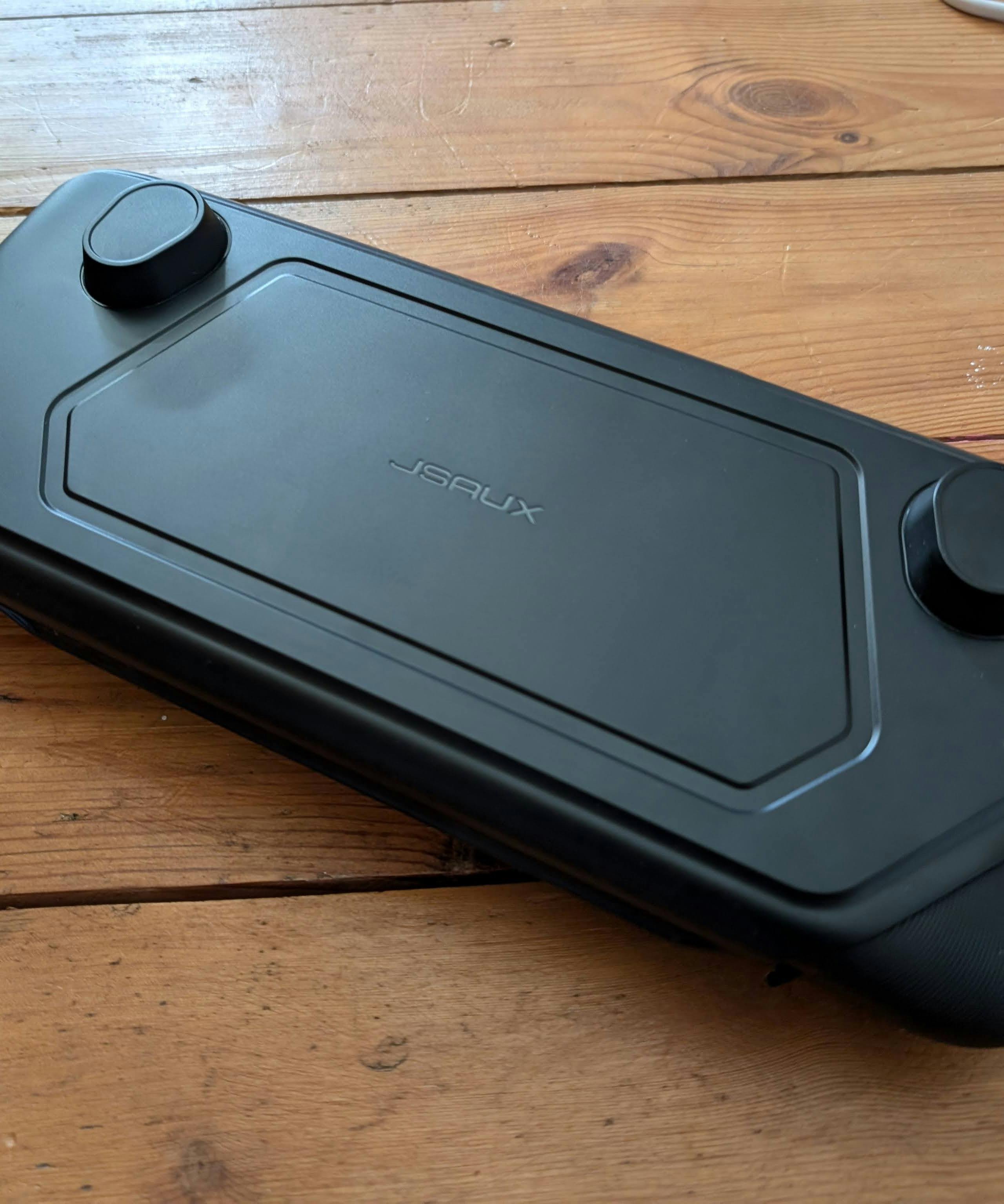 The JSAUX case with the front snapped onto the Steam Deck for protection.