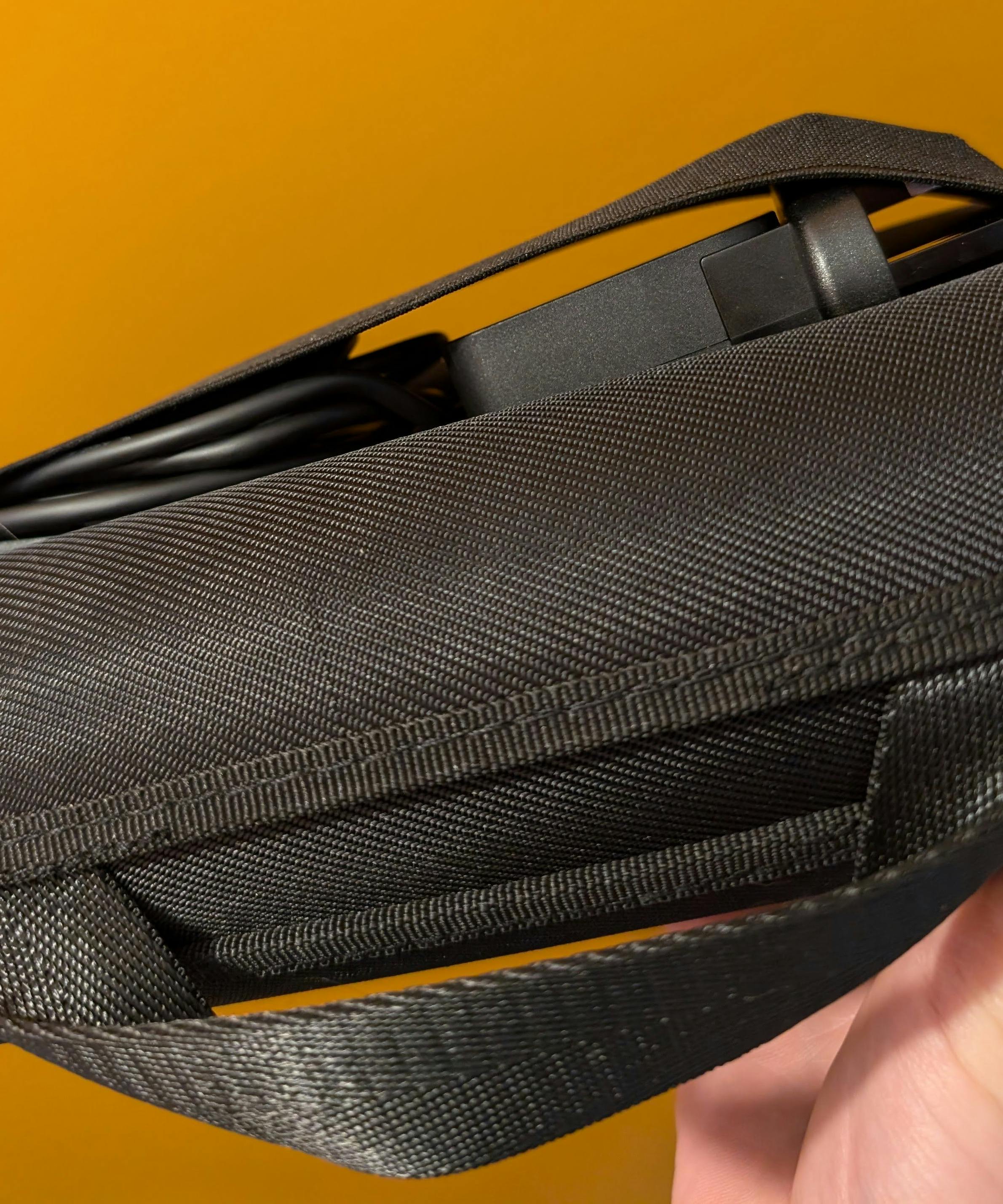 Close up of the Steam Deck official case, with the UK charger bulging out