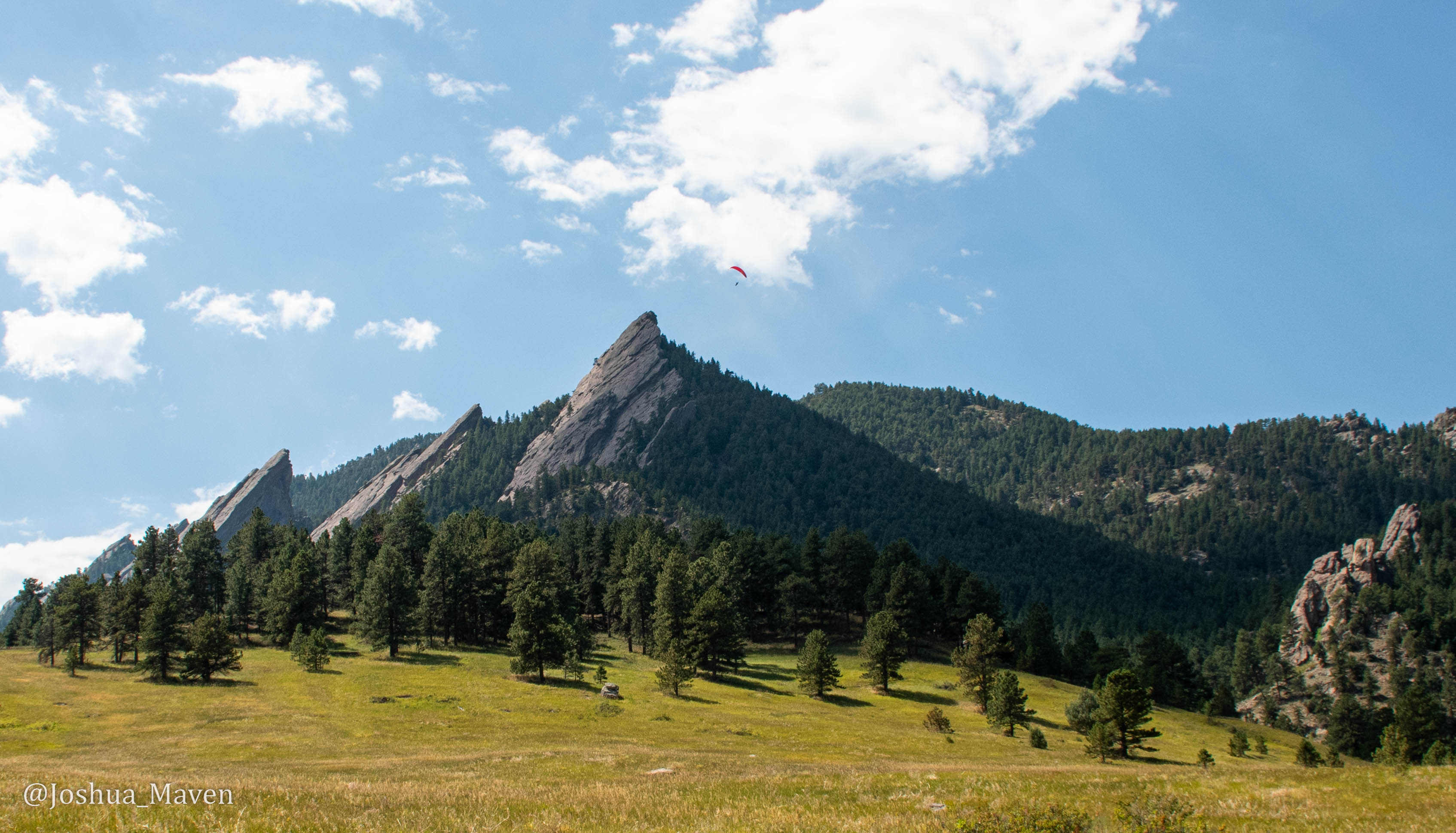 I caught this picture of a paraglider circling the Flatirons just as we completed our hike up nearby Flagstaff Mountain.