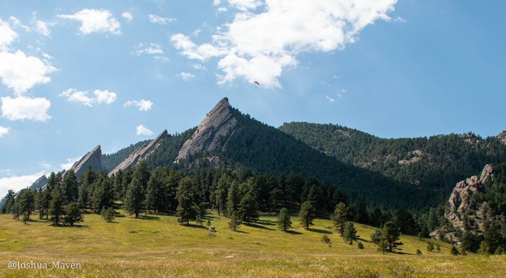 I caught this picture of a paraglider circling the Flatirons just as we completed our hike up nearby Flagstaff Mountain.