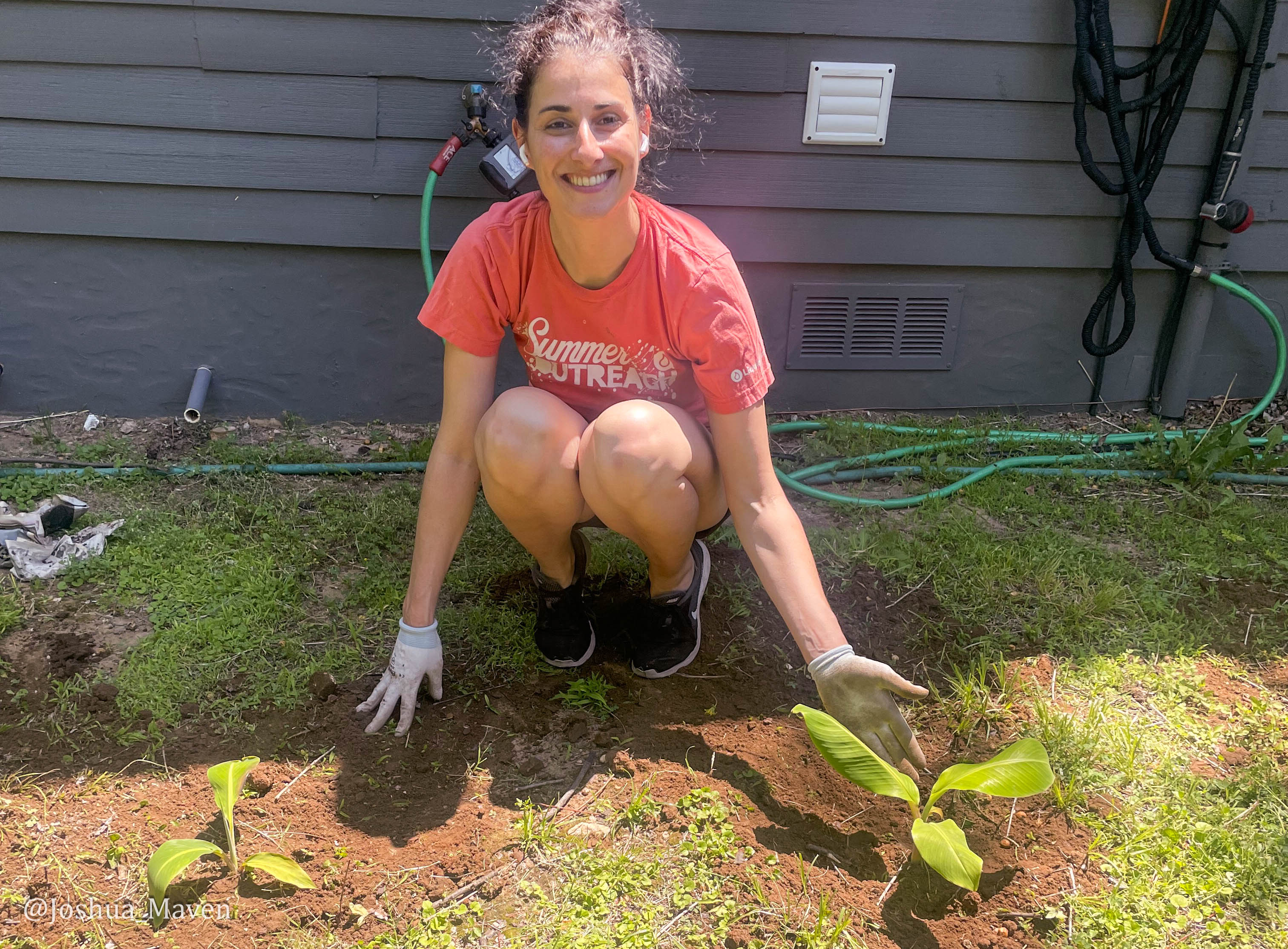 This is my wife Celine after planting the two banana plants, Gene and Mary, in our backyard.