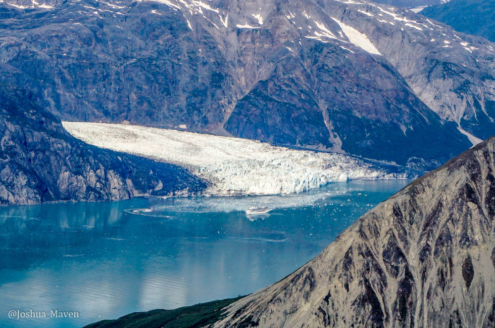 Tidewater glaciers extend into a body of water like this one in Glacier Bay. You can see a cruise ship getting a little too close.