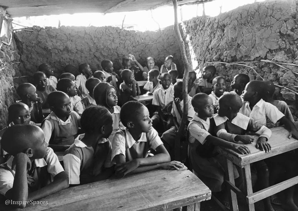 Here's a picture of about 35 kids crammed into the previous stick-and-mud built primary school.