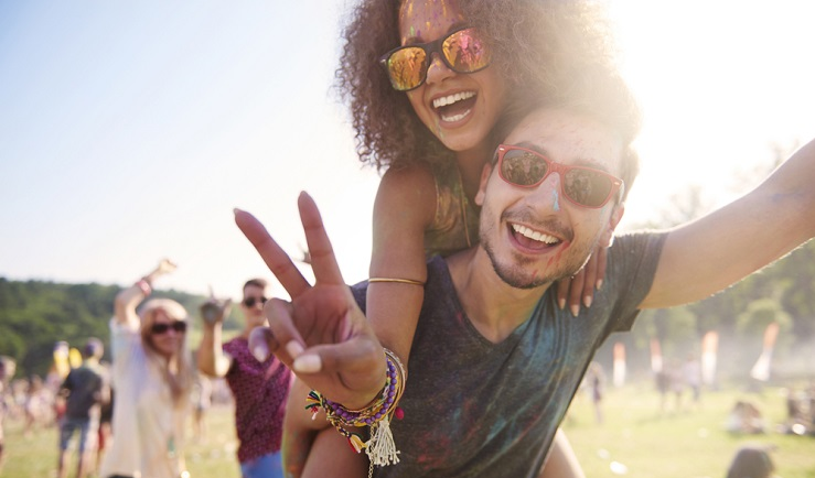Two young people having fun at a festival