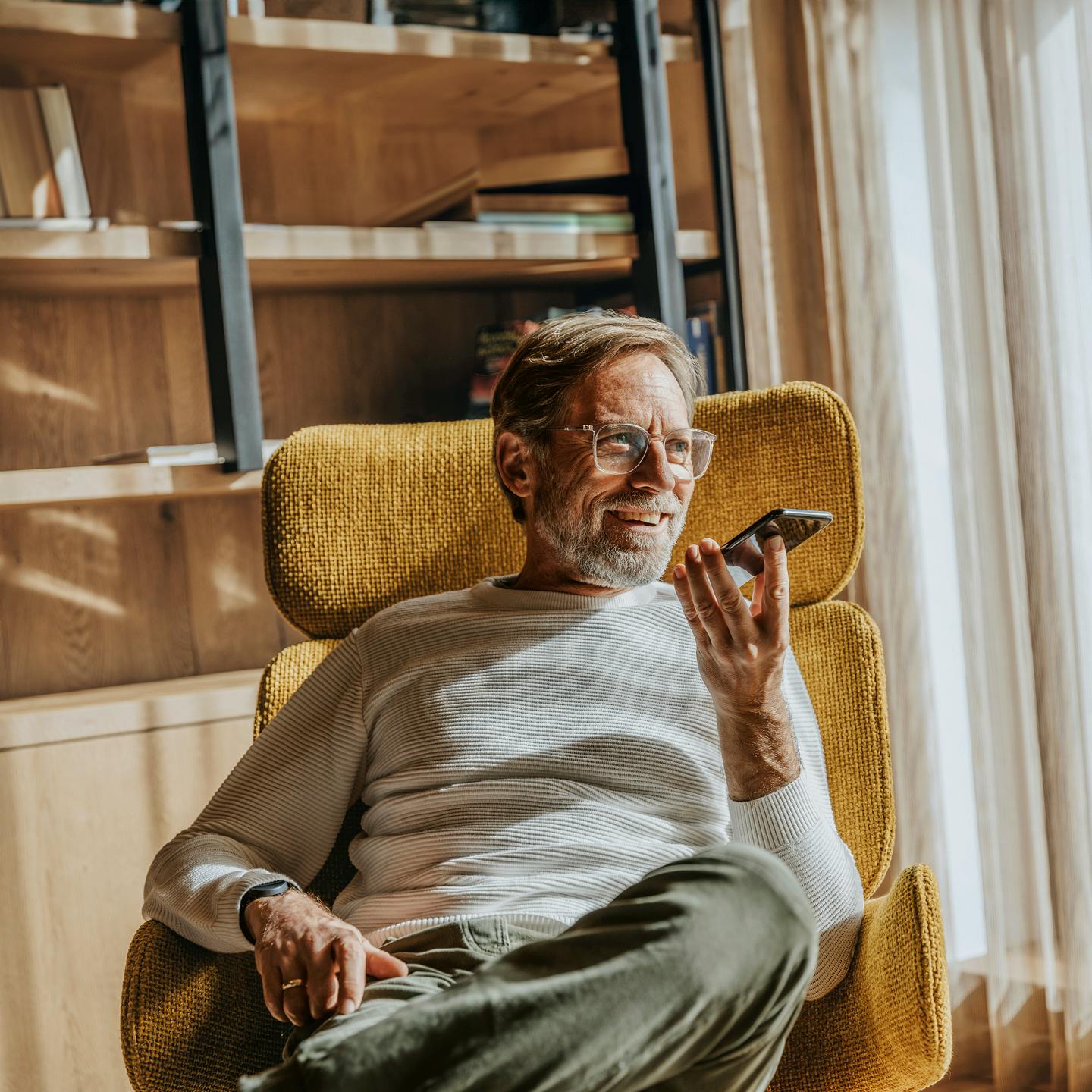 Man sitting down speaking on the phone