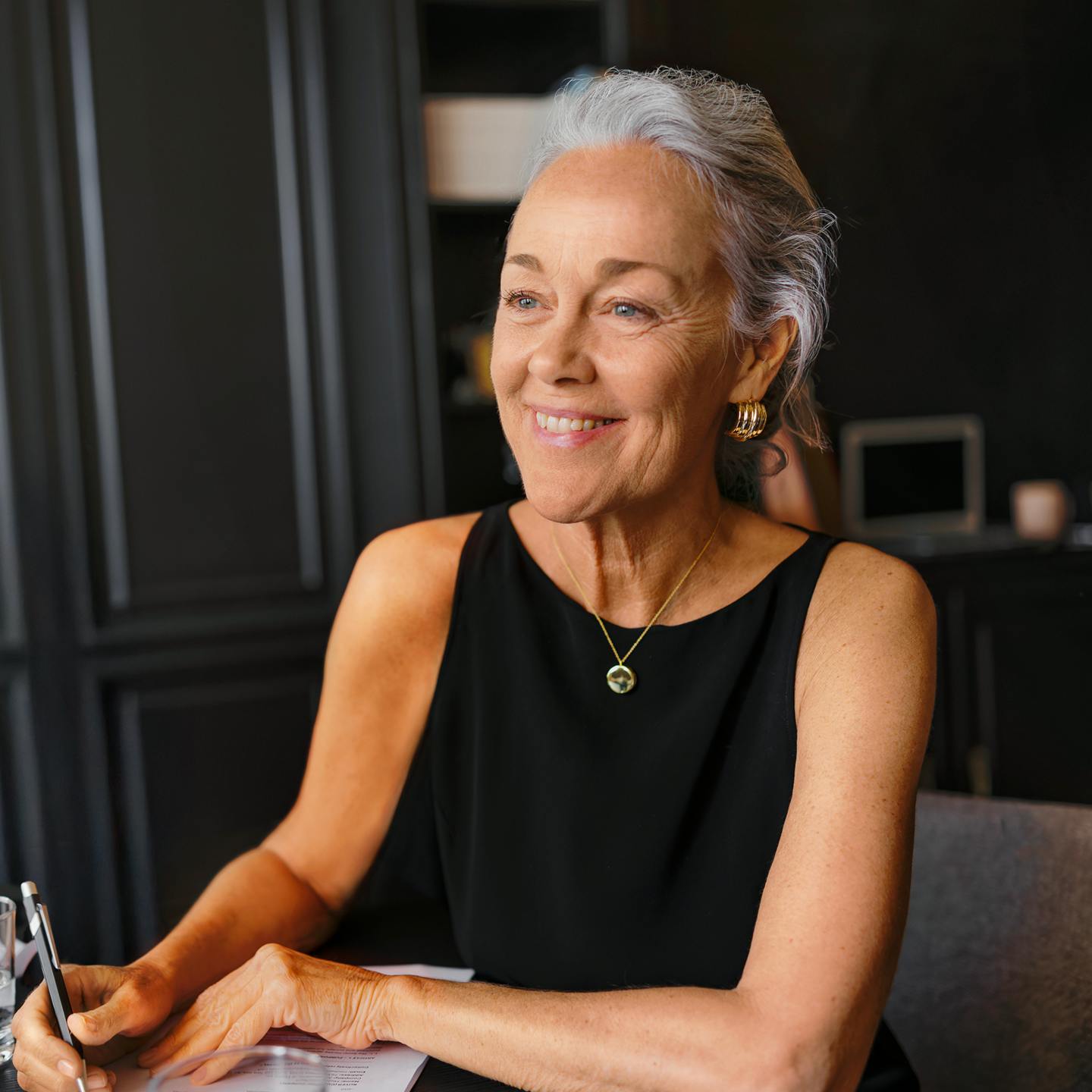 Woman writing in notebook