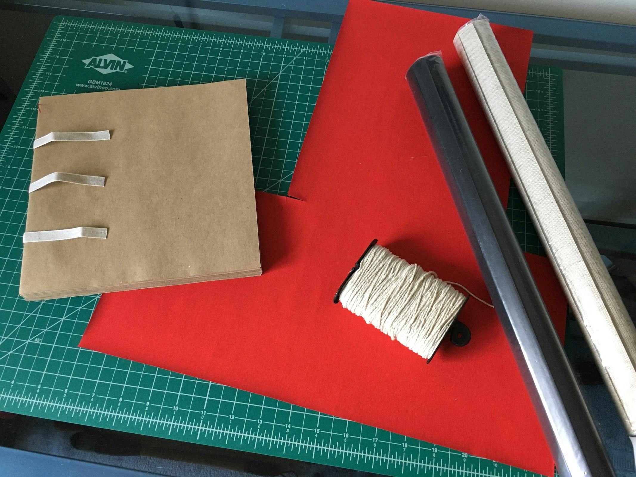The block, cover fabric, and thread for my new sketchbook.