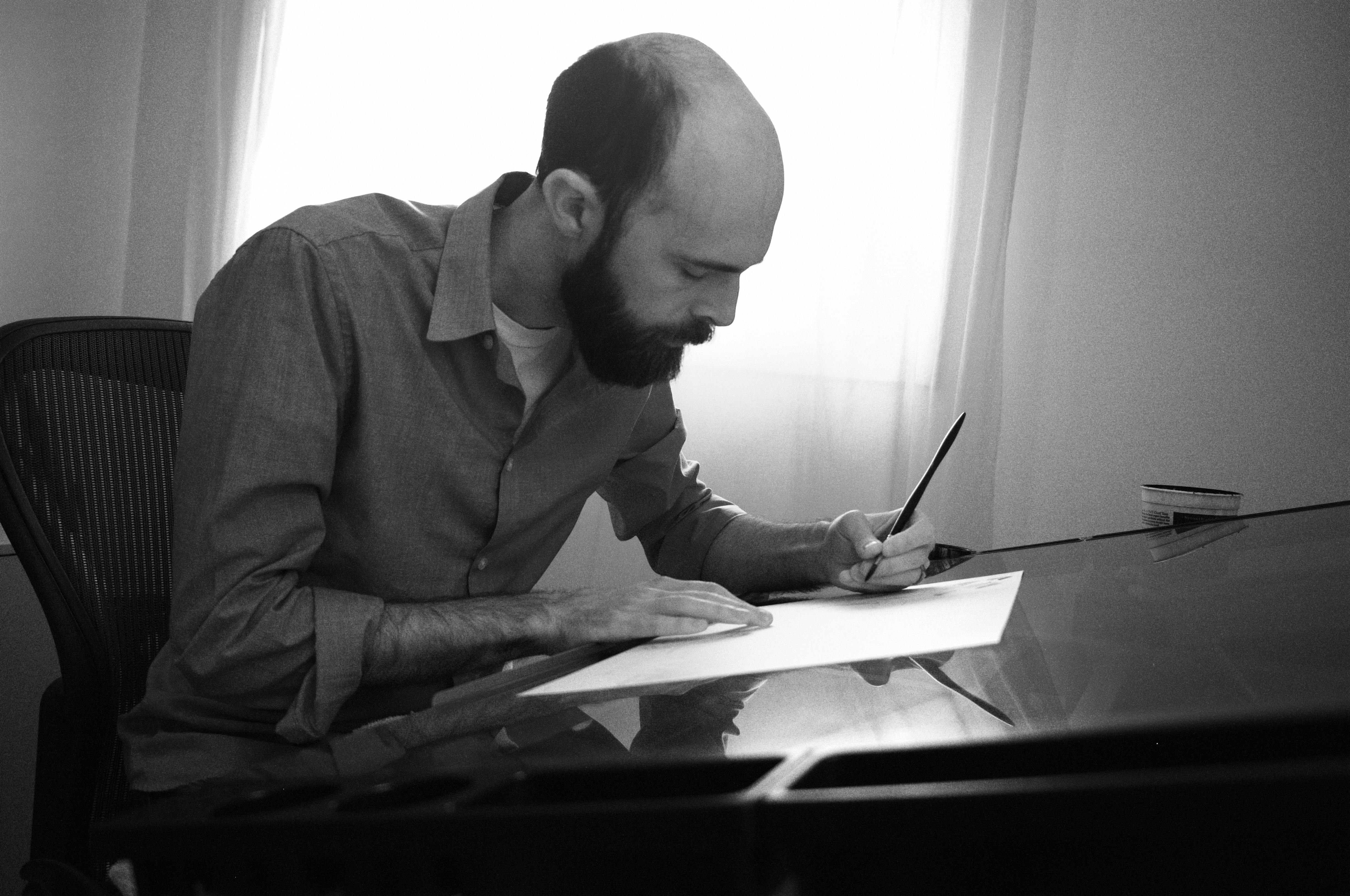 A portrait of me, drawing in my office