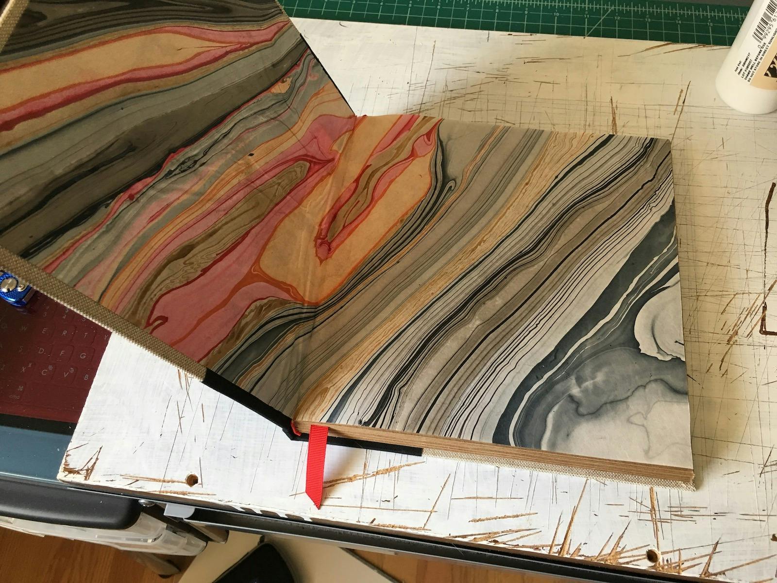 The finished sketchbook, opened to reveal the endpapers