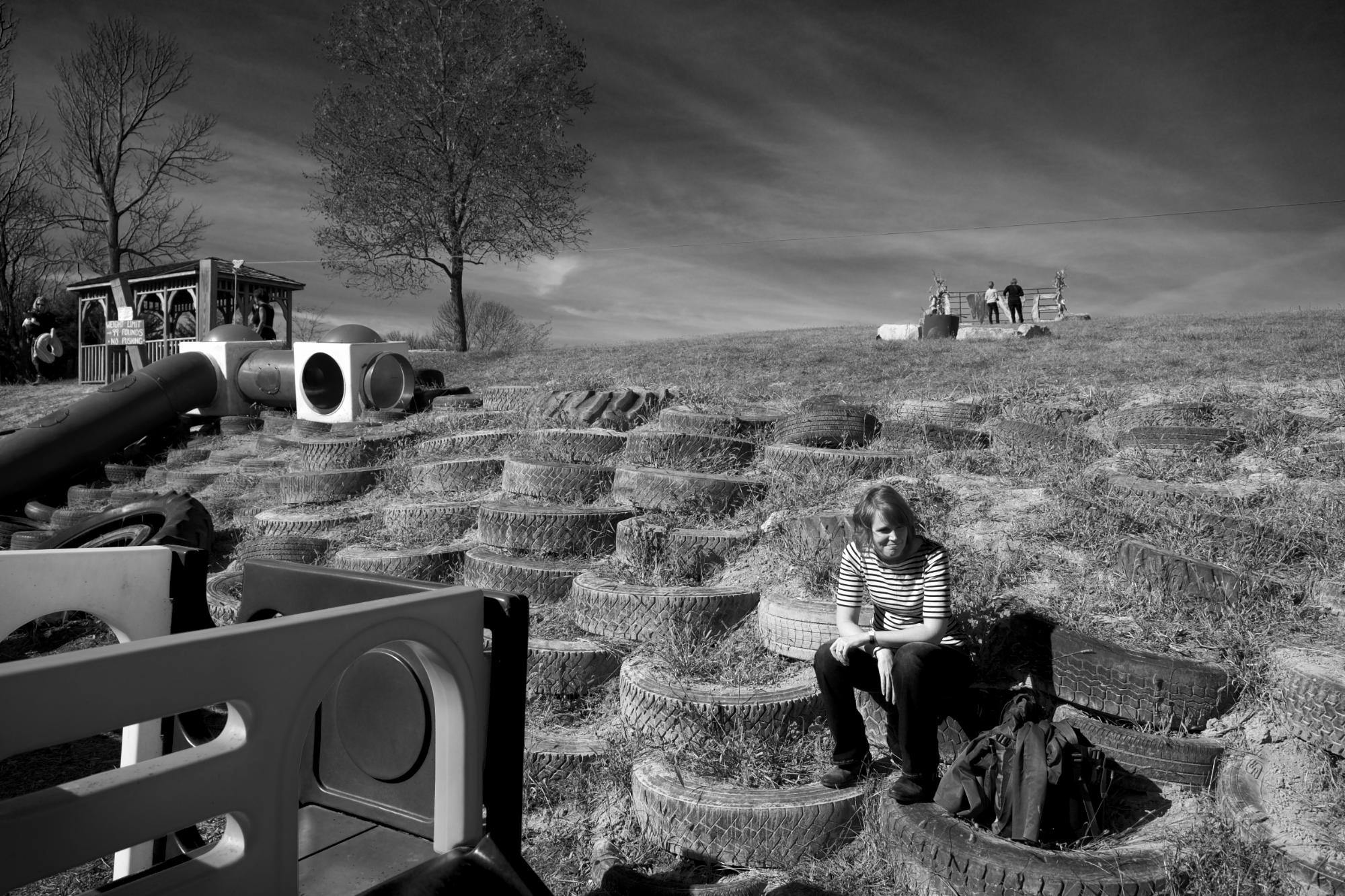 My wife, Jackie, chilling on a pile of old tires.