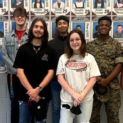 Horn Lake juniors recognized for ACT improvements. Back row, from left: Interim Principal Paul Chrestman, Jacob Brown, David Flores, X'Zorion Piere, and Assistant Principal Mazie Lamb. Front row, from left: Dakota Ross and Graycie Pegram.