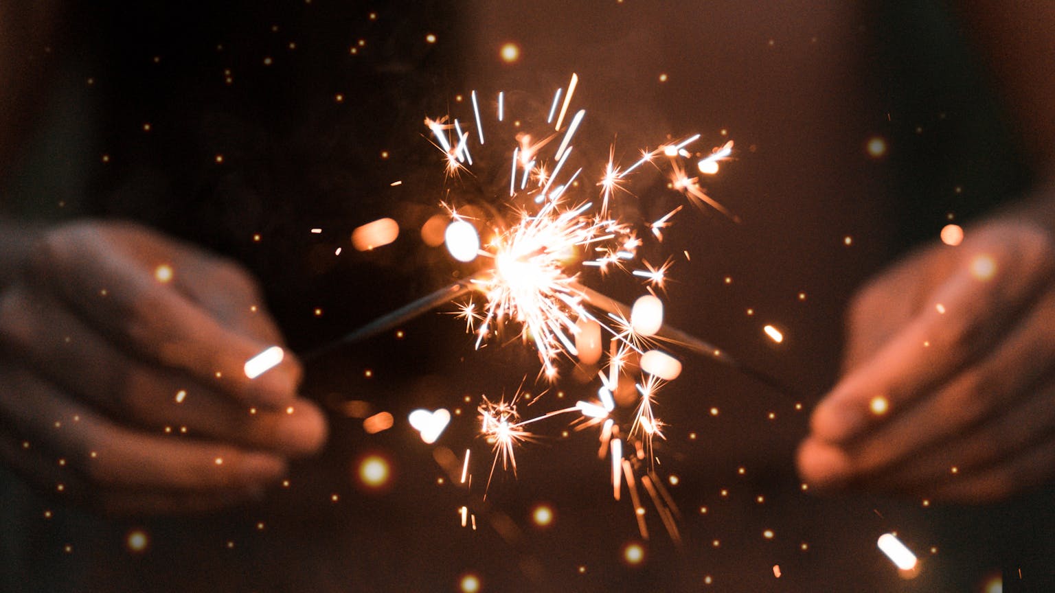 Person holding Sparklers