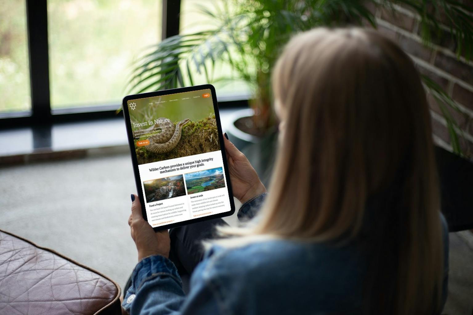 Woman looking at Wilder Carbon website on Tablet 