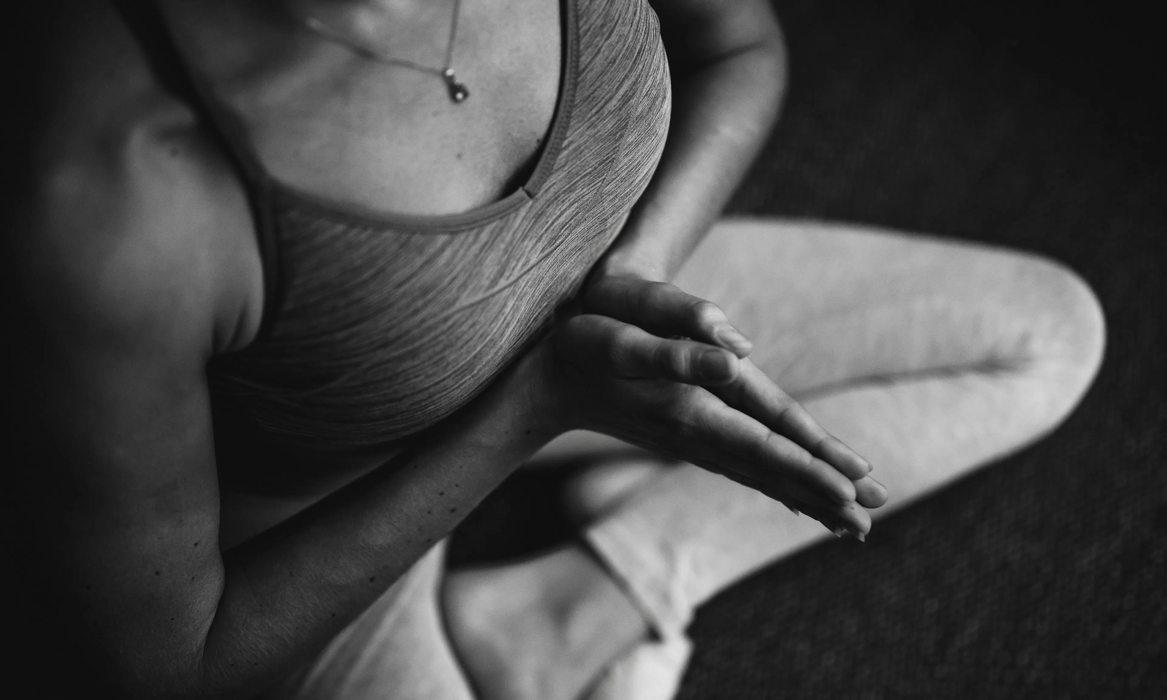 person doing yoga in black and white