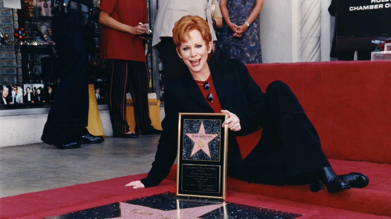 Reba McEntire celebrating her star on the Hollywood Walk of Fame.