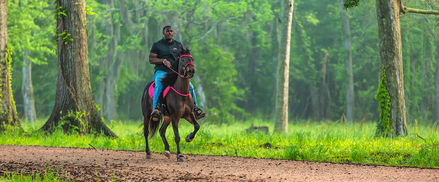 Devin White riding a horse