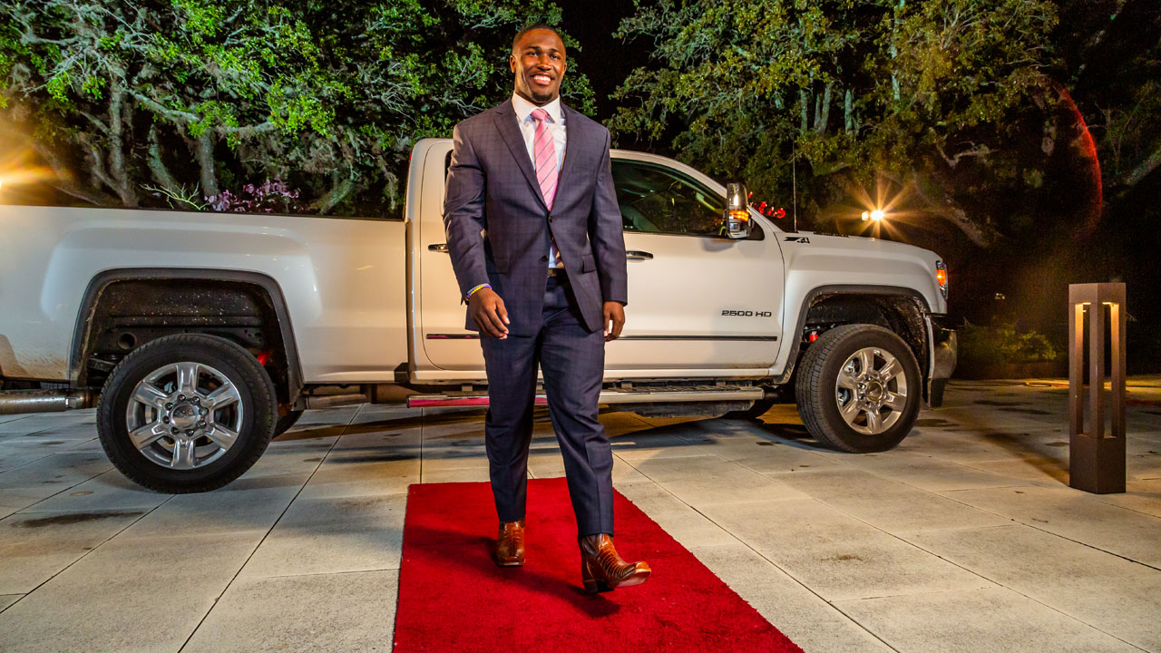 Devin White wearing his custom Justin Boots on a red carpet.