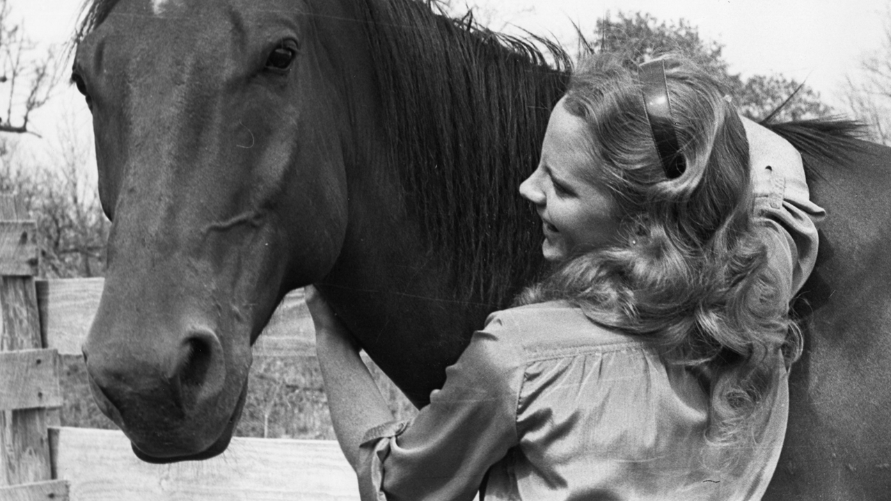 Growing up, ranching and rodeo was all Reba knew. Here is Reba at a young age with her horse.