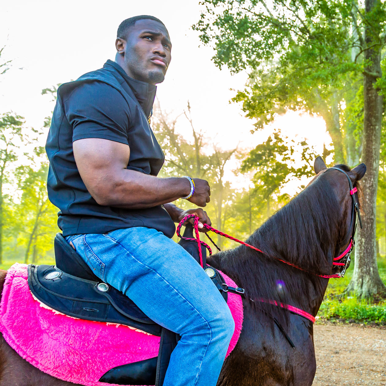 Devin White sitting on his horse Daisy Mae