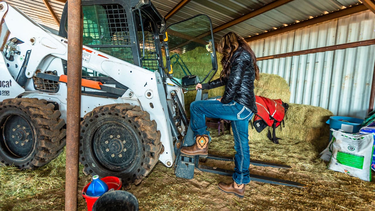 Women standing in barn wearing Justin Gypsy work boot WKL9979