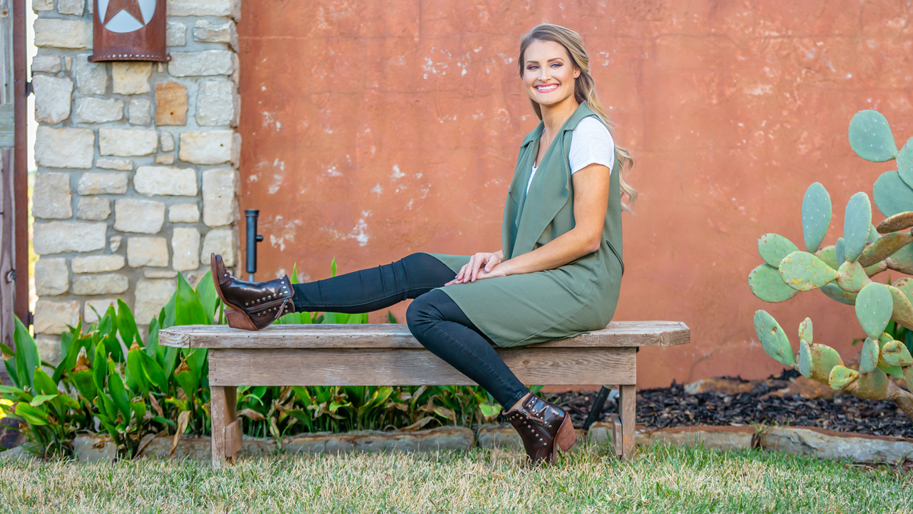 Woman wearing the Reba by Justin® Nashville Russett (dark brown).