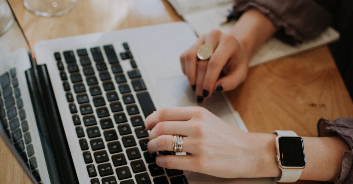 woman typing on laptop