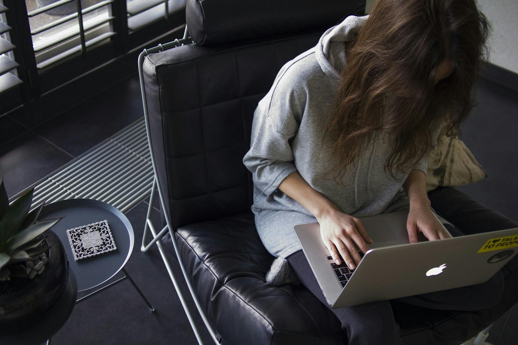 Woman remote working on laptop