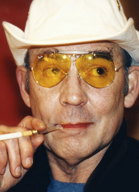 Hunter S. Thompson wearing yellow aviator sunglasses
