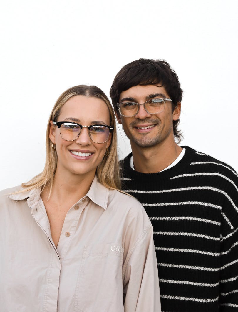 Man and woman wearing prescription glasses