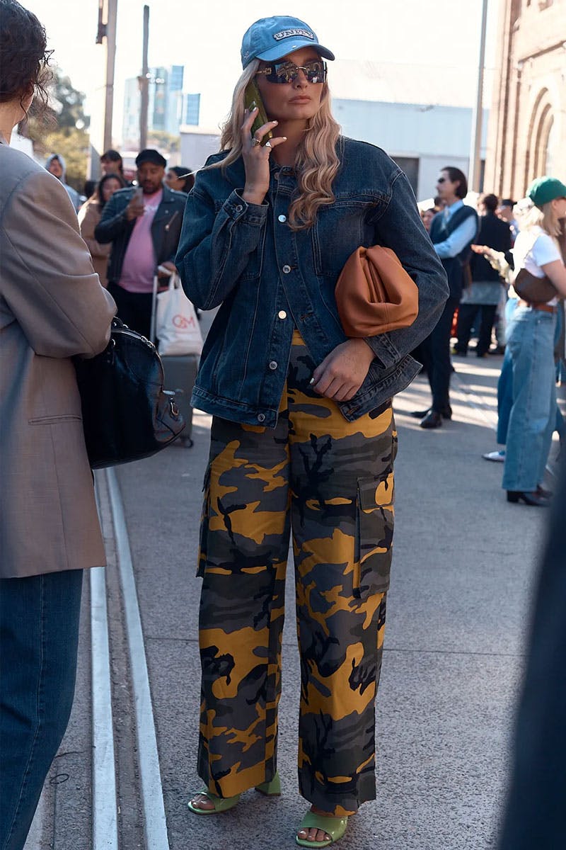 Woman wearing Miu Miu sunglasses at Australian Fashion Week. 