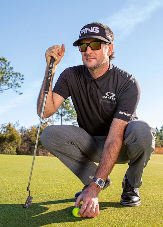 Man playing golf wearing sunglasses