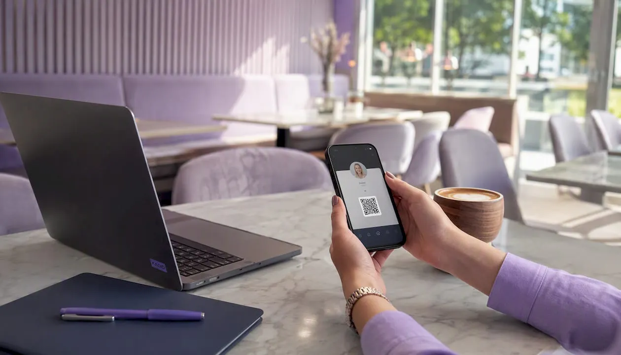 Desk with digital business card dashboard and phone
