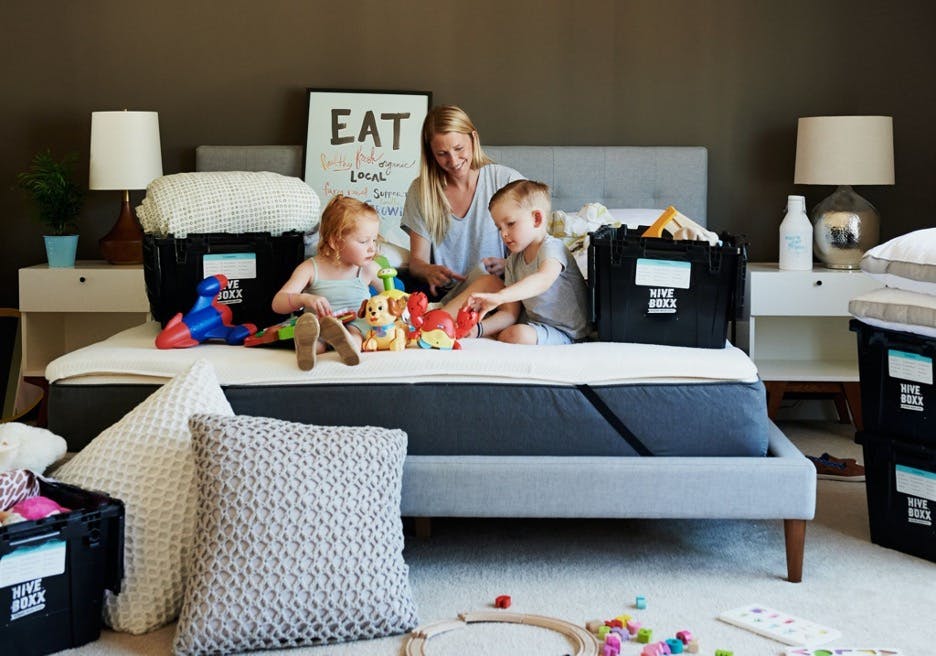 A mother playing with her kids at home