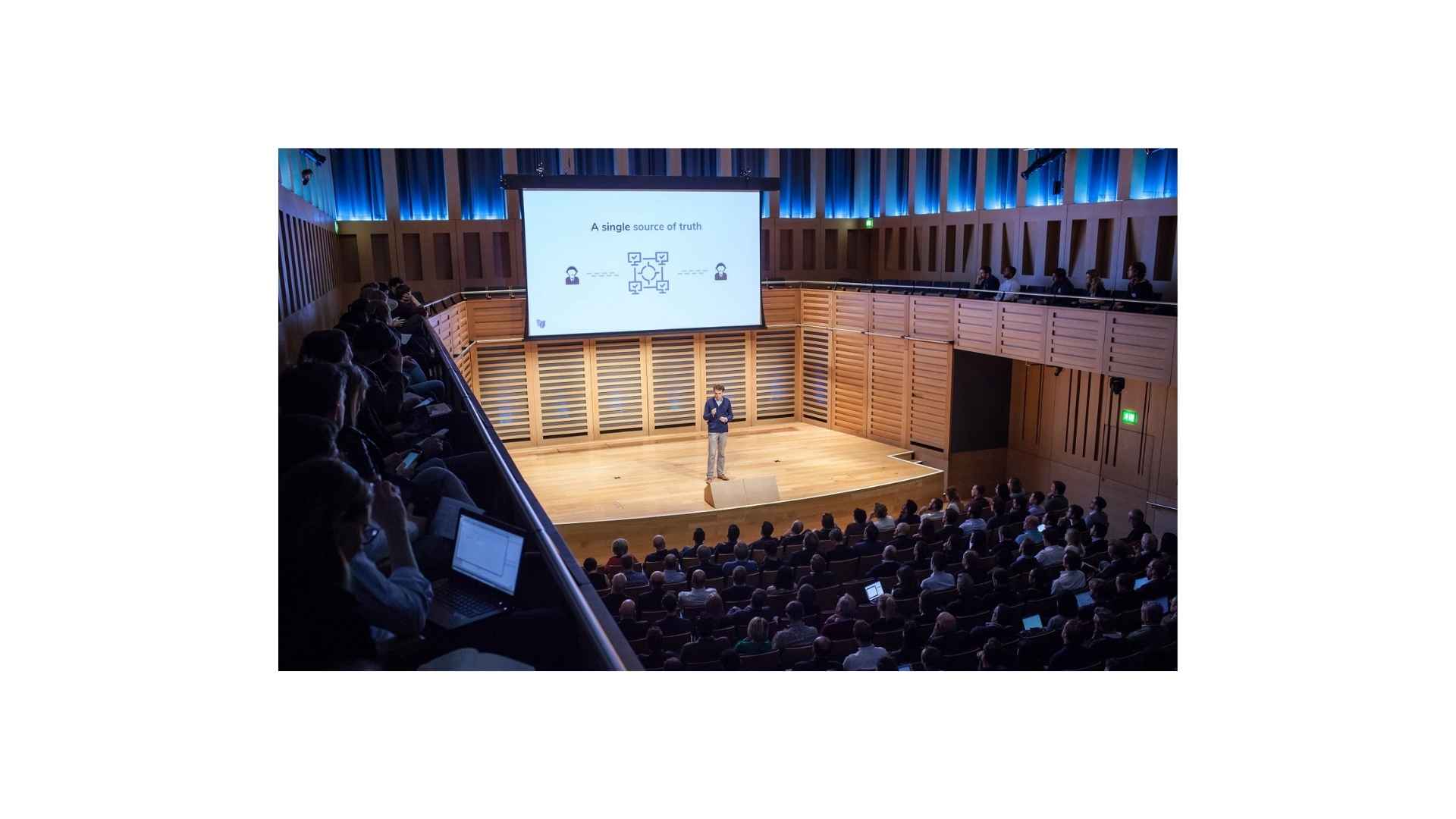 Founders pitching to investors at a startup demo night