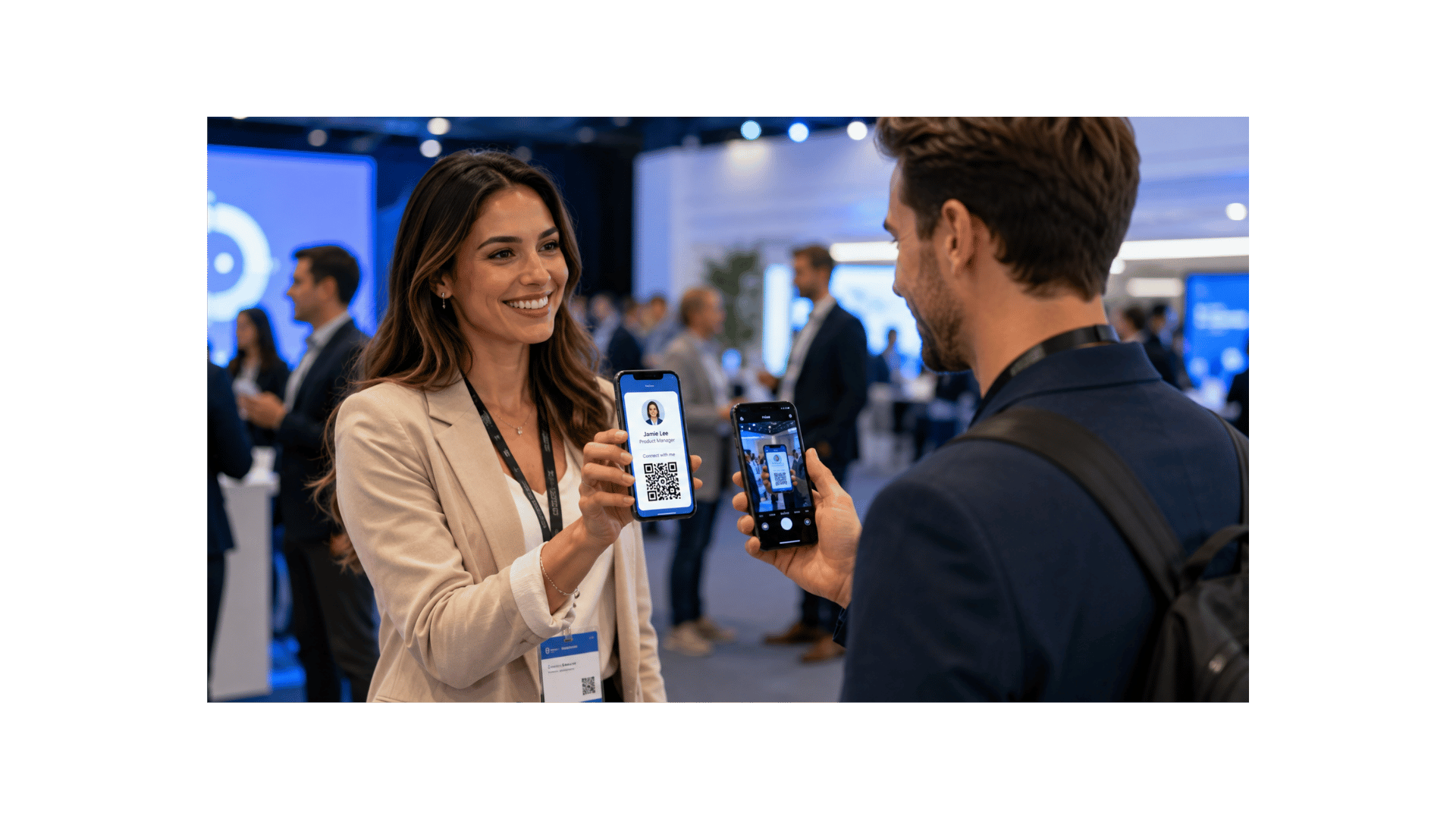 Two professionals exchanging contact information via QR code