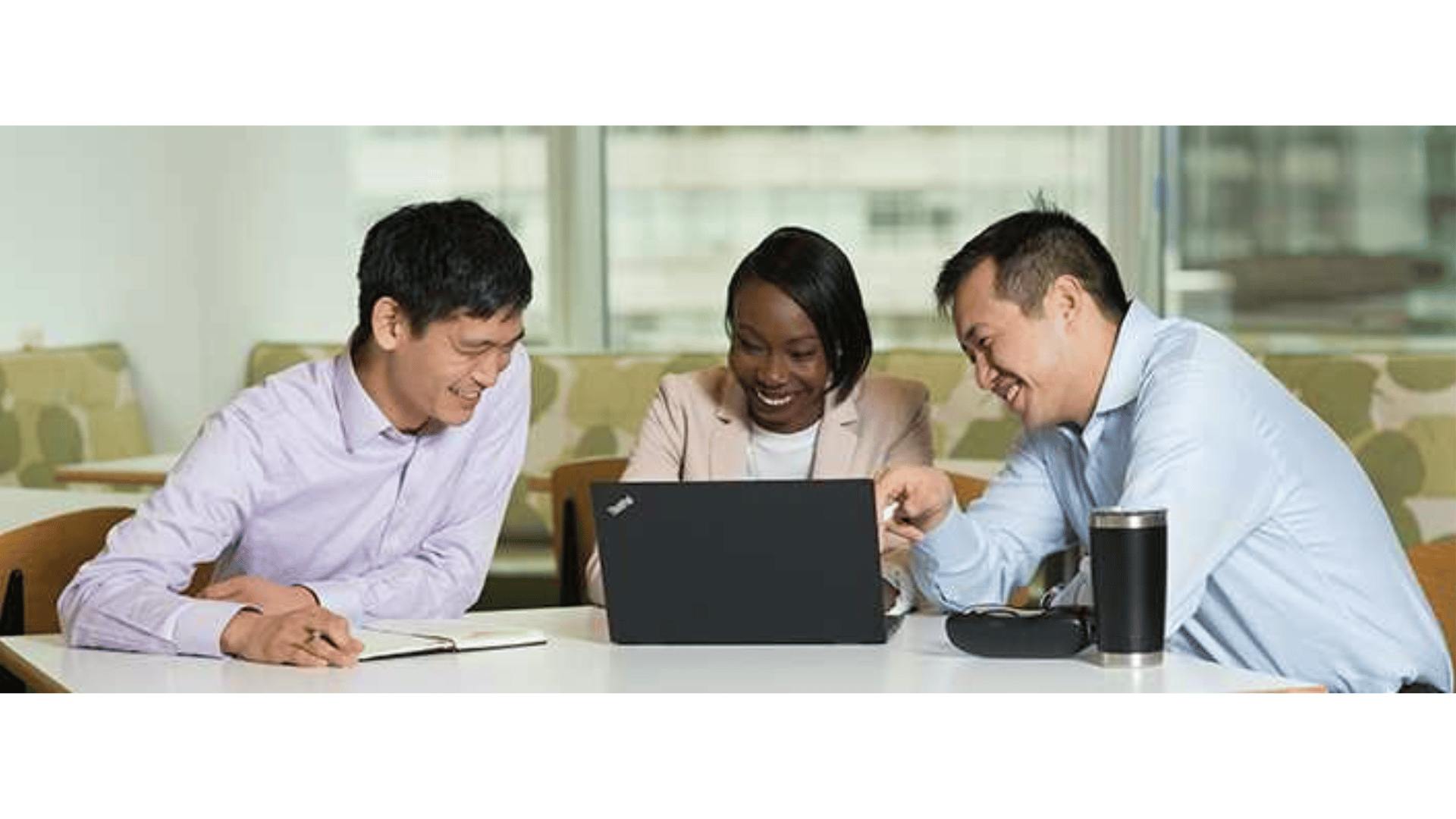 people looking at a laptop