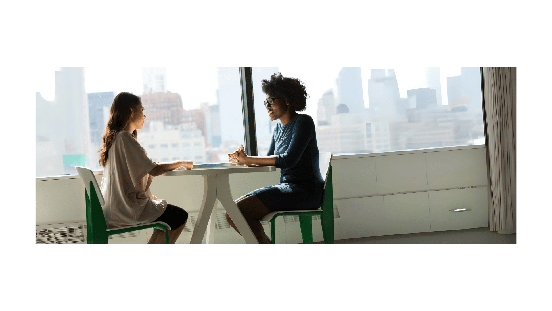 two girls talking sitting down