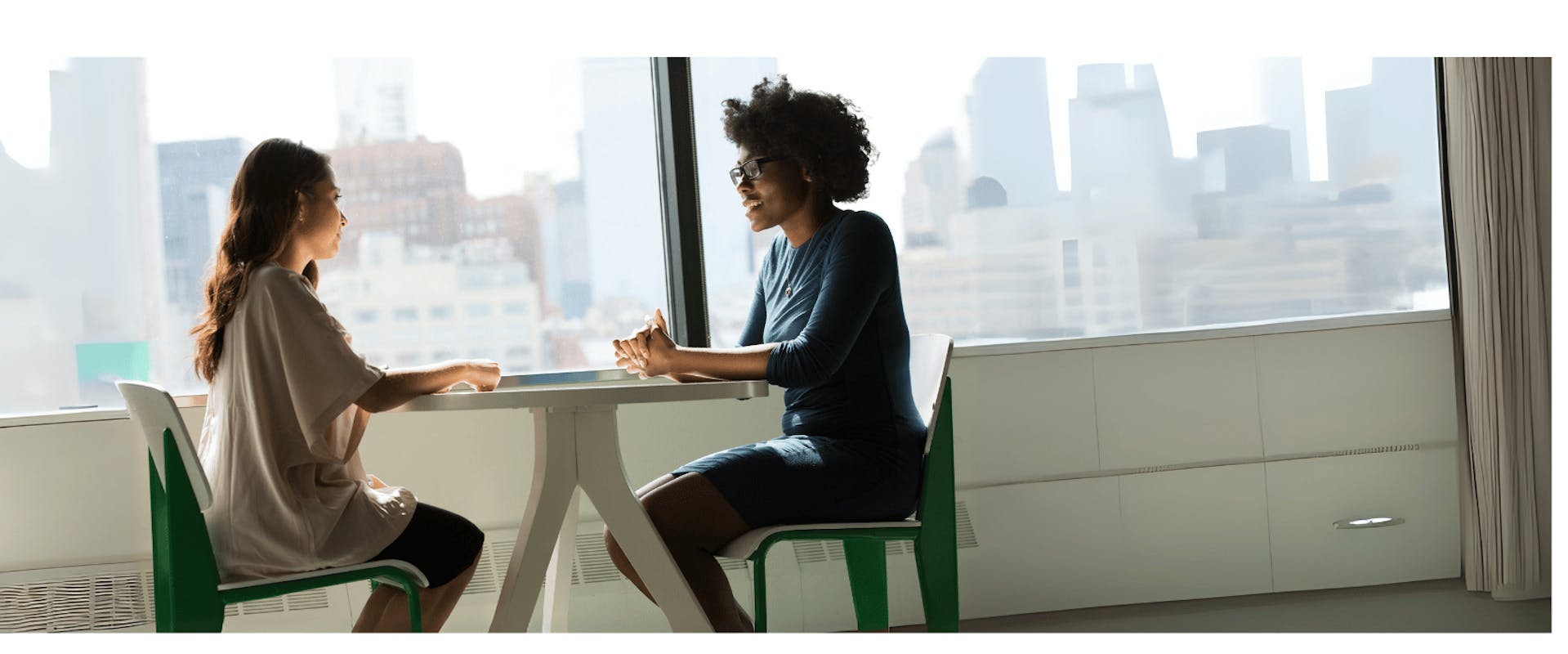 two girls talking sitting down