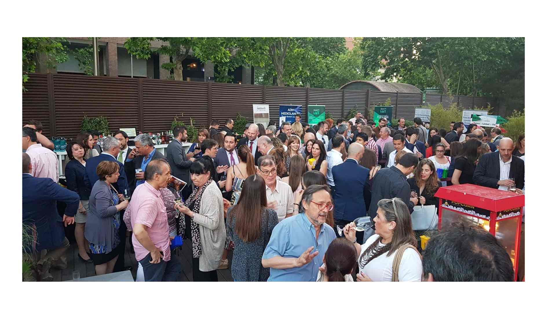 Diverse group of international professionals networking at a Madrid tech