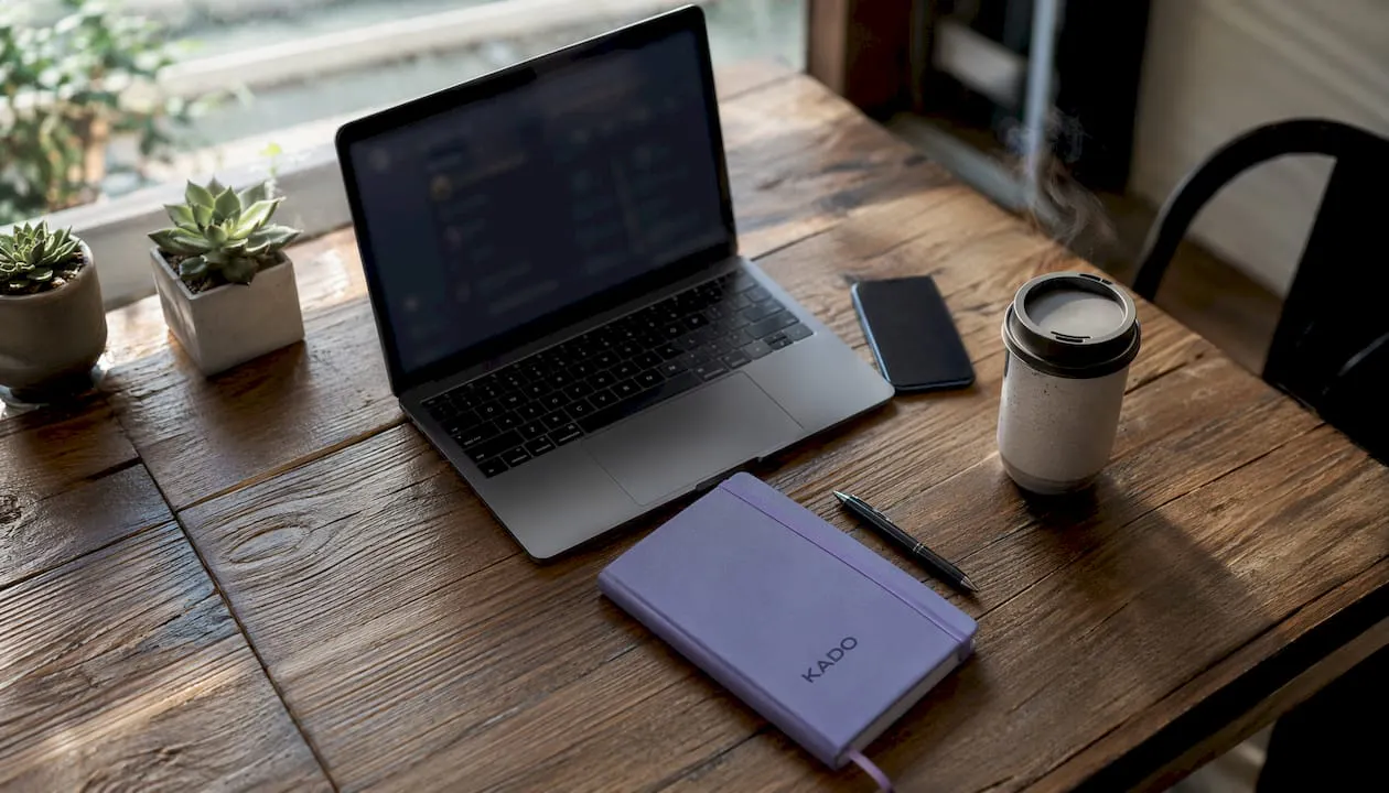 Contact management dashboard and smartphone on office desk