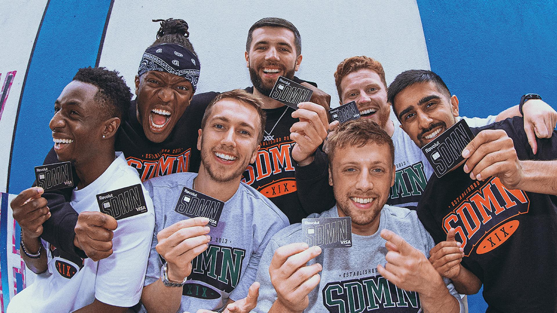 The Sidemen holding Revolut cards