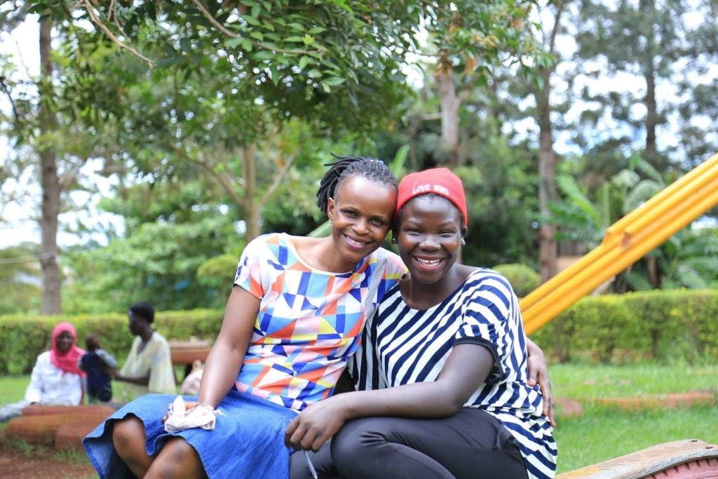 Community worker having a moment with the youth at St. Francis health care services