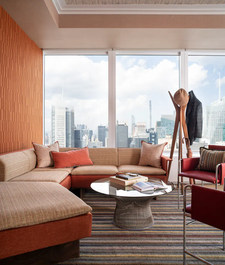 Luxury executive office lounge at One Penn Plaza designed by K.A. Murphy Interiors with custom furnishings, contemporary textiles, and panoramic New York City views.