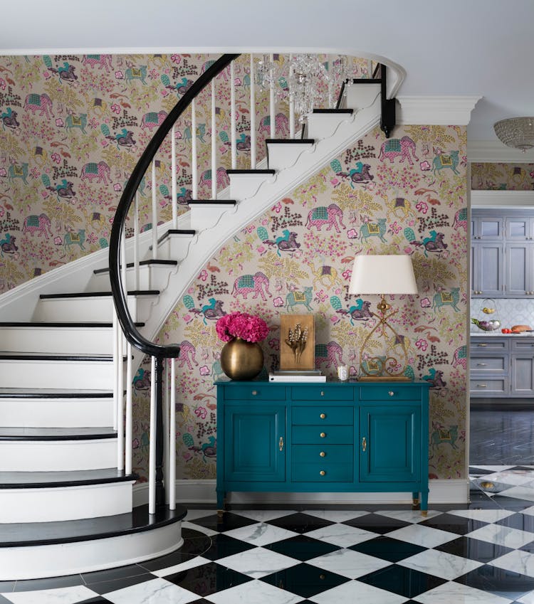 Grand entryway in a Long Island Colonial Revival home with classic architectural features and sophisticated design, by K.A. Murphy Interiors