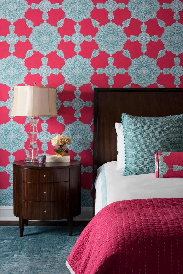 Playful kids’ bedroom in a Long Island Colonial Revival home featuring vibrant colors, custom bedding, and layered textures, designed by K.A. Murphy Interiors.