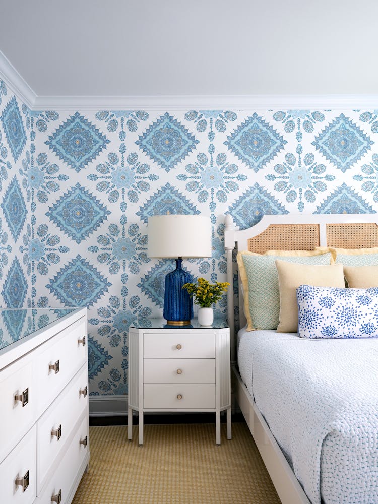 Playful kids’ bedroom in a Long Island Colonial Revival home featuring vibrant colors, custom bedding, and layered textures, designed by K.A. Murphy Interiors